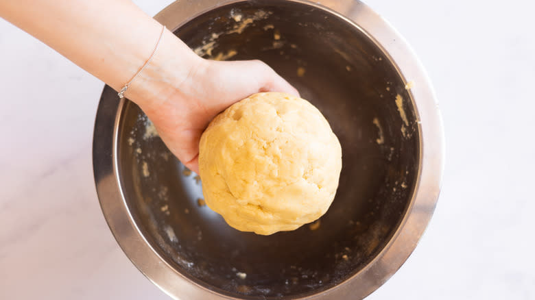 dough ball in hand 