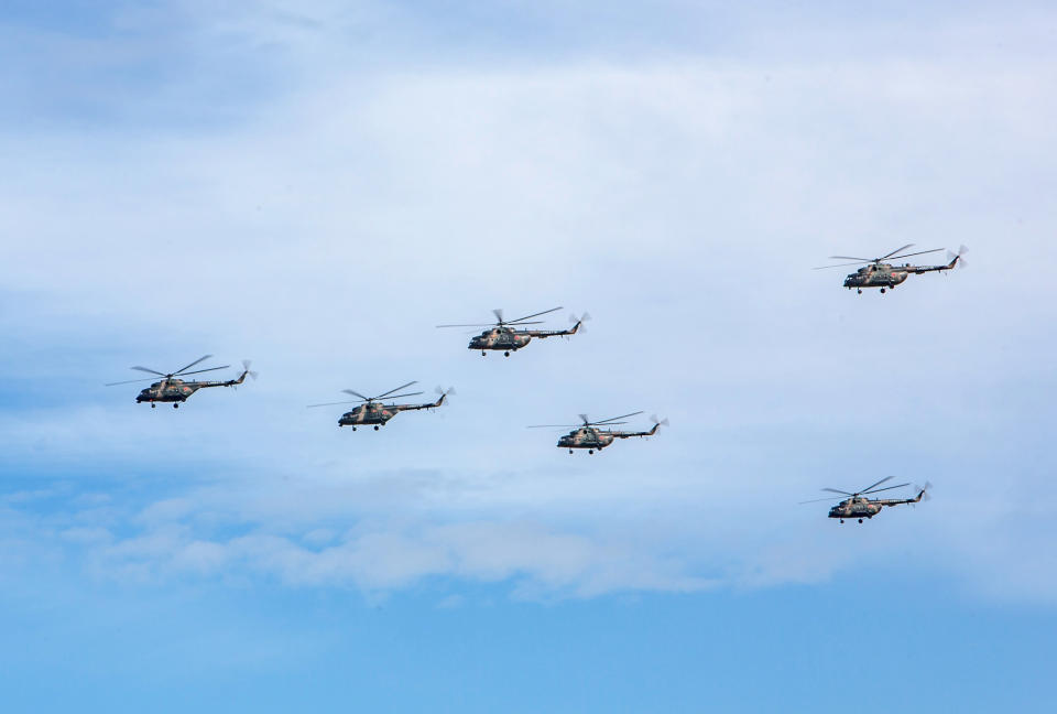 In this photo provided by Russian Defense Ministry Press Service on Tuesday, Sept. 11, 2018. Russian military helicopters fly, in the Chita region, Eastern Siberia, during the Vostok 2018 exercises in Russia. Russia's military chief of staff says that the military exercises expected to be the biggest in three decades, will involve nearly 300,000 troops. (Russian Defense Ministry Press Service pool photo via AP)