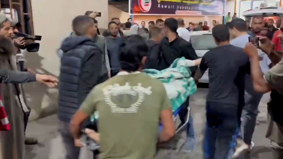 Palestinians arrive at Al Kuwaiti Hospital in Rafah, Gaza, after Israeli air strikes on May 8. - CNN