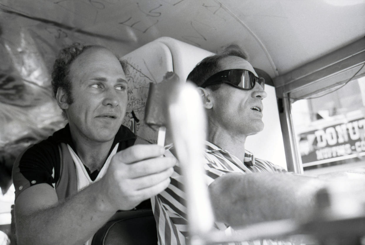 Ken Kesey and driver Neal Cassady roll through NYC in 1964 on Further, an old school bus that George Walker advised using instead of cars for the Merry Pranksters’ transcontinental shenanigans. (Credit: David Gahr/Getty Images)