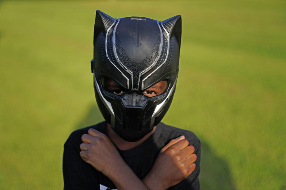 Black Panthers fan, Keyon Griffin, 7, of South Carolina, poses for a portrait during a Chadwick Boseman Tribute on Thursday, Sept. 3, 2020, in Anderson, S.C. (AP Photo/Brynn Anderson)
