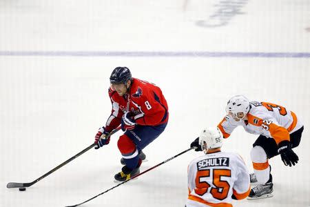 Apr 22, 2016; Washington, DC, USA; Washington Capitals left wing Alex Ovechkin (8) skates with the puck as Philadelphia Flyers defenseman Mark Streit (32) chases in the third period in game five of the first round of the 2016 Stanley Cup Playoffs at Verizon Center. Mandatory Credit: Geoff Burke-USA TODAY Sports