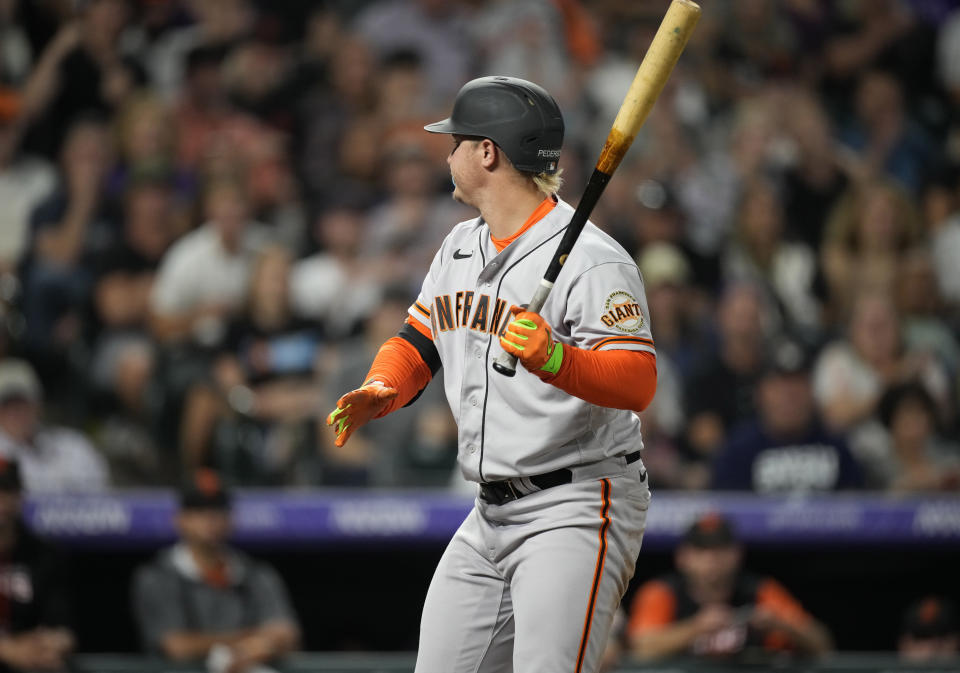 San Francisco Giants' Joc Pederson reacts after striking out against Colorado Rockies relief pitcher Lucas Gilbreath to end the top of the seventh inning of a baseball game Friday, Aug. 19, 2022, in Denver. (AP Photo/David Zalubowski)