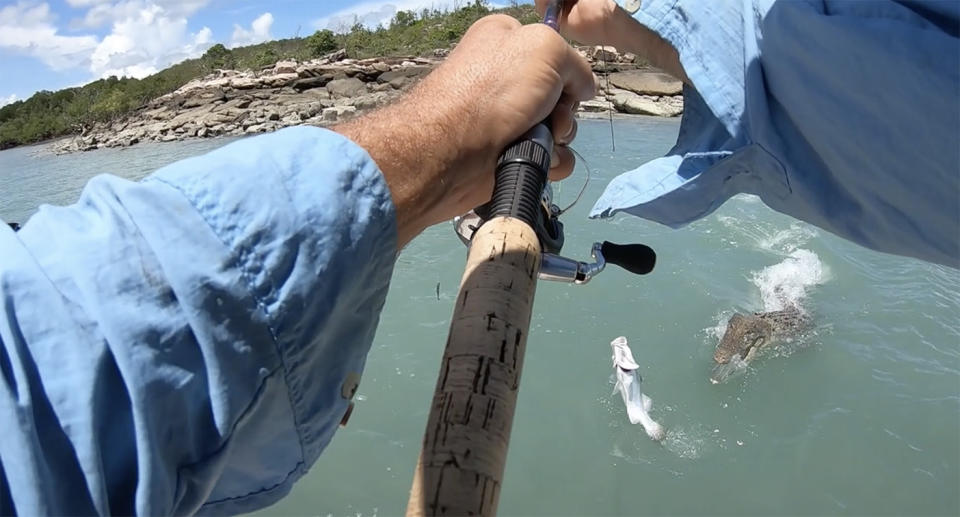 Scott Lowther just managed to save his catch from the hungry crocodile at Buckingham Bay. Source: Supplied