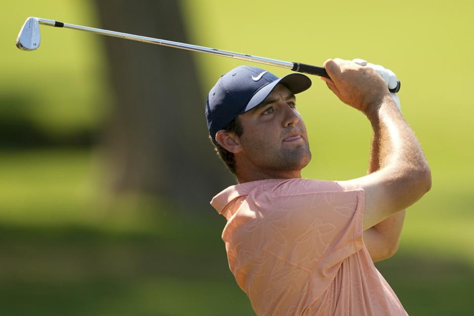 Scottie Scheffler makes a tee shot during the first round of the PGA Championship.