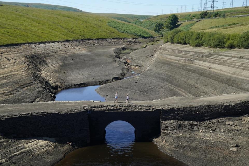 Dry, cracked earth seen at Baitings Reservoir in Ripponden, West Yorkshire (PA Wire)