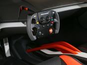 <h3>The car comes with a steering wheel that looks like a video game controller!</h3>