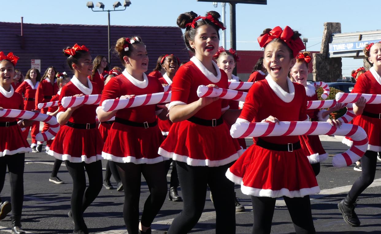 Dancers from The Talent Planet Dance Studio in Hesperia perform Saturday during the 74th Annual Victorville Christmas Parade.