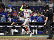 Atlanta Braves designated hitter Marcell Ozuna celebrates hitting a home run during the ninth inning of a baseball game against the Miami Marlins, Friday, April 12, 2024, in Miami. (AP Photo/Michael Laughlin)