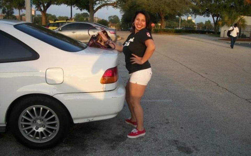 Stephanie Loraine Piñeiro poses for a photo next to the car she owned when she was 17. She drove the same car to a clinic in Florida that provided her with abortion care. (Courtesy Stephanie Loraine)