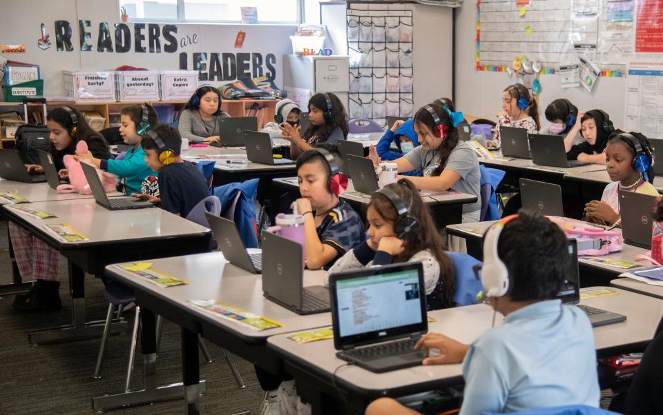 Students work on lessons during the Ignite tutoring program at Aspire Rosa Parks Academy in Stockton on Mar. 26, 2024.