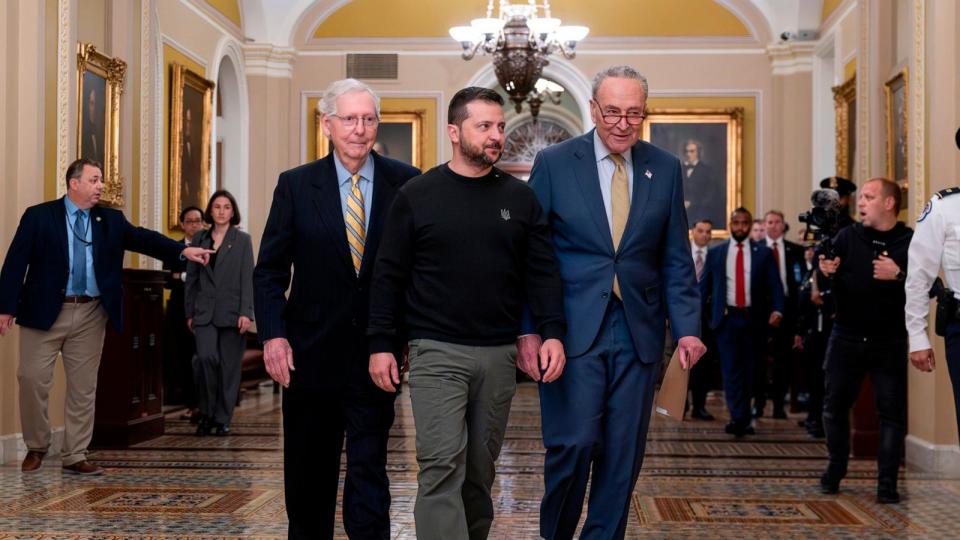 PHOTO: Ukrainian President Volodymyr Zelenskyy, center, is escorted by Senate Minority Leader Mitch McConnell, R-Ky., left, and Senate Majority Leader Chuck Schumer, D-N.Y., and as he comes to the Capitol. Dec. 12, 2023, in Washington. (J. Scott Applewhite/AP)