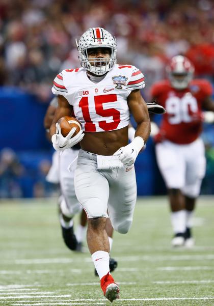 NEW ORLEANS, LA - JANUARY 01: Ezekiel Elliott #15 of the Ohio State Buckeyes runs the ball against the Alabama Crimson Tide during the All State Sugar Bowl at the Mercedes-Benz Superdome on January 1, 2015 in New Orleans, Louisiana. (Photo by Kevin C. Cox/Getty Images)