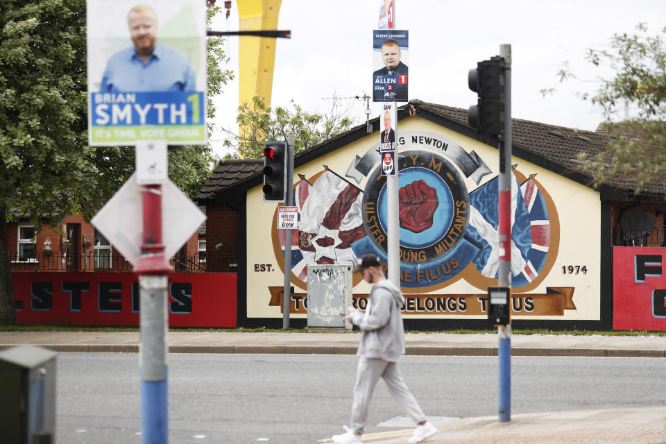 Election posters hang from lamp posts in the mainly Loyalist Newtownards road area of East Belfast, Northern Ireland, Monday, May 2, 2022, ahead of the May 5, 2022 local elections. (AP Photo/Peter Morrison)