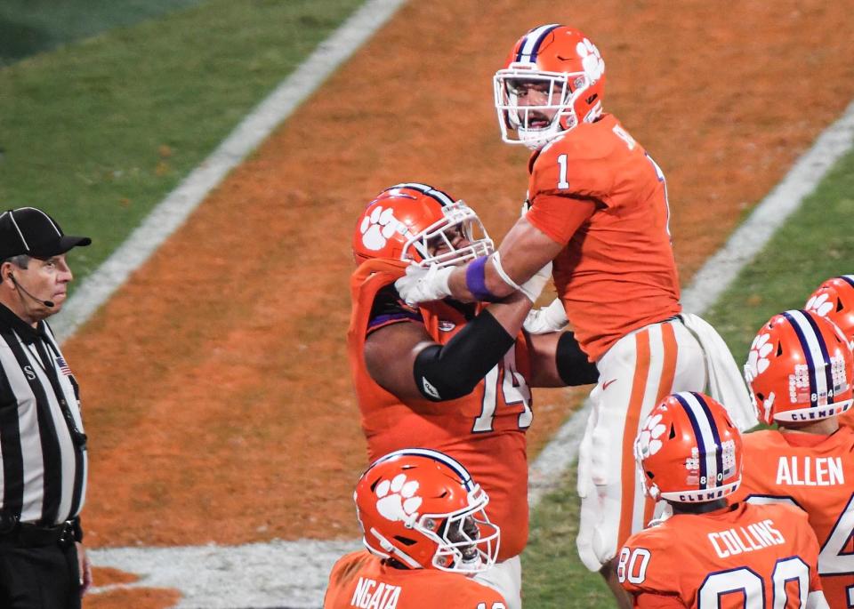 Clemson offensive lineman Marcus Tate (74) lifts running back Will Shipley (1) after he ran in a touchdown against Louisiana Tech during the first quarter at Memorial Stadium in Clemson, South Carolina Saturday, September 17, 2022.  