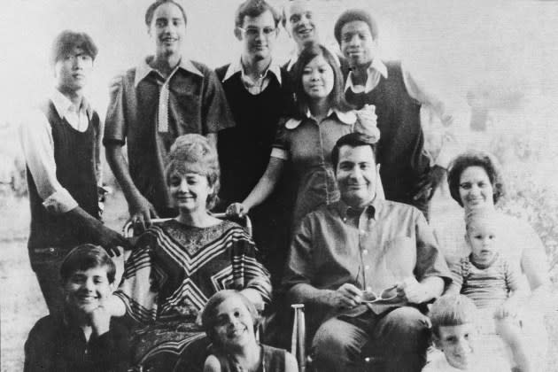 Peoples Temple founder Jim Jones is pictured in a family portrait with his wife, Marceline Jones, their adopted children (behind Jones), and his sister-in-law (right) with her three children in California, 1976. - Credit: Don Hogan Charles/New York Times Co./Getty Images/Courtesy of National Geographic