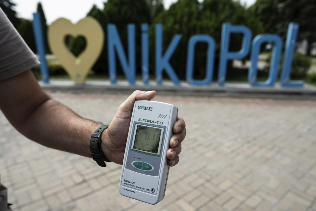 FILE - A Geiger counter shows increased radiation level in Nikopol, Ukraine, Aug, 22, 2022. Ukrainians are once again anxious and alarmed about the fate of a nuclear power plant in a land that was home to the world’s worst atomic accident in 1986 at Chernobyl. The Zaporizhzhia nuclear plant, Europe’s largest, has been occupied by Russian forces since early in the war, and continued fighting nearby has heightened fears of a catastrophe that could affect nearby towns in southern Ukraine or beyond. (AP Photo/Evgeniy Maloletka, File)