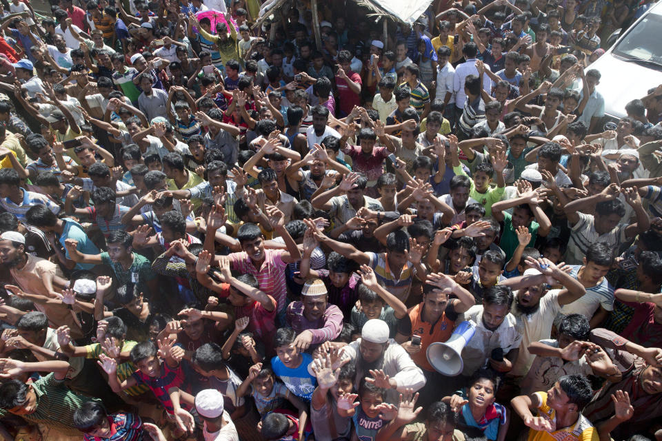 Rohingya refugees shout slogan during a protest against the repatriation process at Unchiprang refugee camp near Cox's Bazar, in Bangladesh, Thursday, Nov. 15, 2018. The head of Bangladesh's refugee commission said plans to begin a voluntary repatriation of Rohingya Muslim refugees to their native Myanmar on Thursday were scrapped after officials were unable to find anyone who wanted to return. (AP Photo/Dar Yasin)