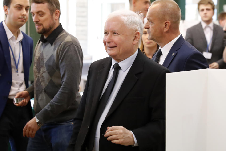 The ruling party leader Jaroslaw Kaczynski leaves polling station after his vote in Warsaw, Poland, Sunday, Oct. 13, 2019. Poles are voting Sunday in a parliamentary election that Kaczynski is favored to win easily, buoyed by the popularity of its social conservatism and generous social spending policies that have reduced poverty. (AP Photo/Darko Bandic)