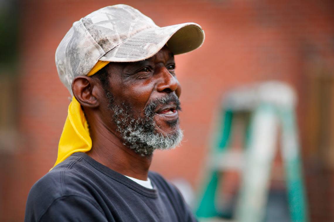 Albert Mills pauses Tuesday while painting a church in Plains, Georgia to talk about Jimmy Carter’s impact on Plains. 02/21/2023