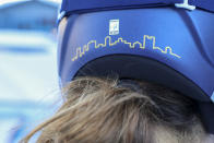 Italy's Sofia Goggia sports Bergamo's skyline on the back of her racing helmet, in the finish area of an alpine ski, women's World Cup downhill race, in Zauchensee, Austria, Saturday, Jan. 15, 2022. Defending Olympic gold medalists Sofia Goggia and Michela Moioli both come from the Bergamo area that was the first epicenter of COVID-19 in Europe. Goggia skis with a design of Bergamo's skyline on the back of her racing helmet. Moioli lost her grandmother to the virus. (AP Photo/Marco Trovati)