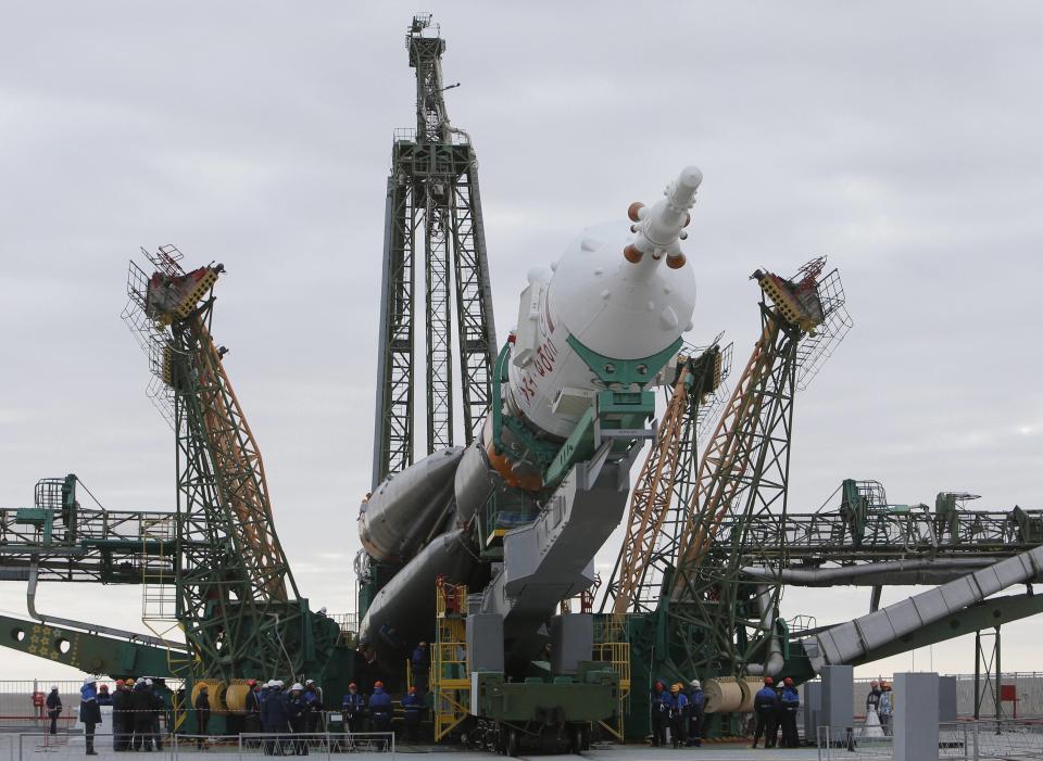 The Soyuz TMA-12M spacecraft is lifted on its launch pad at the Baikonur cosmodrome