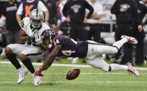 <p>Houston Texans cornerback Johnathan Joseph (24) breaks up a pass intended for Oakland Raiders wide receiver Amari Cooper (89) during the first half of an AFC Wild Card NFL game Saturday, Jan. 7, 2017, in Houston. (AP Photo/Eric Christian Smith) </p>