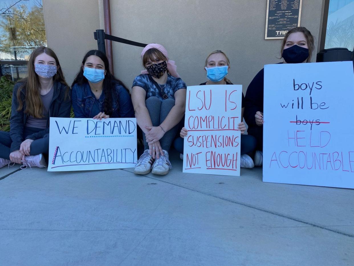 LSU students protest earlier this year in front of the university's Football Operations Center demanding stiffer punishment for athletic executives who sat on sexual misconduct allegations.