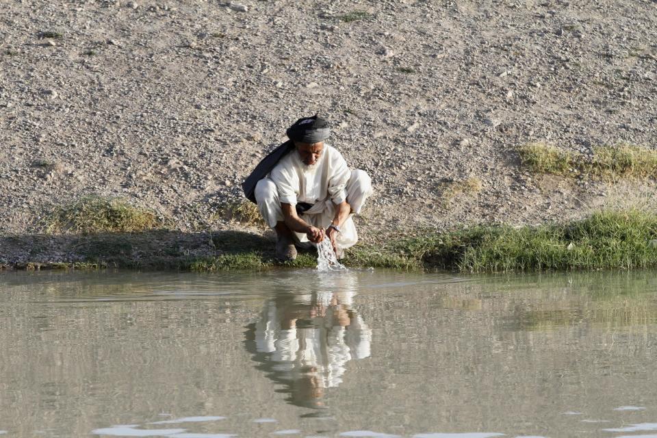 An Afghan elderly man performs ablution before praying during the Islamic fasting month of Ramadan on the outskirts of Kandahar, south of Kabul, Afghanistan, Thursday, July 24, 2014. Ramadan is a Muslim holy month of fasting, during which Muslims abstain from food, drink and other pleasures from sunrise to sunset. It is the time Muslims believe God started to reveal the Quran to the Prophet Muhammad. For believers, Ramadan is meant to be a time of reflection and worship, remembering the hardships of others and being charitable. (AP Photo/Allauddin Khan)