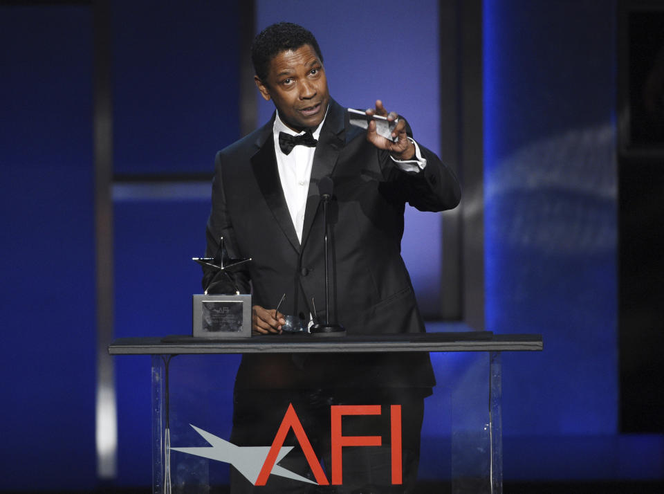 FILE - In this June 6, 2019, file photo, actor Denzel Washington addresses the audience during the 47th AFI Life Achievement Award ceremony honoring him in Los Angeles. The award-winning actor, director, and producer is the face of some of the most well-known films of the last few decades, including “Fences,” “Man on Fire,” “Malcolm X,” and “The Book of Eli.” (Photo by Chris Pizzello/Invision/AP, File)