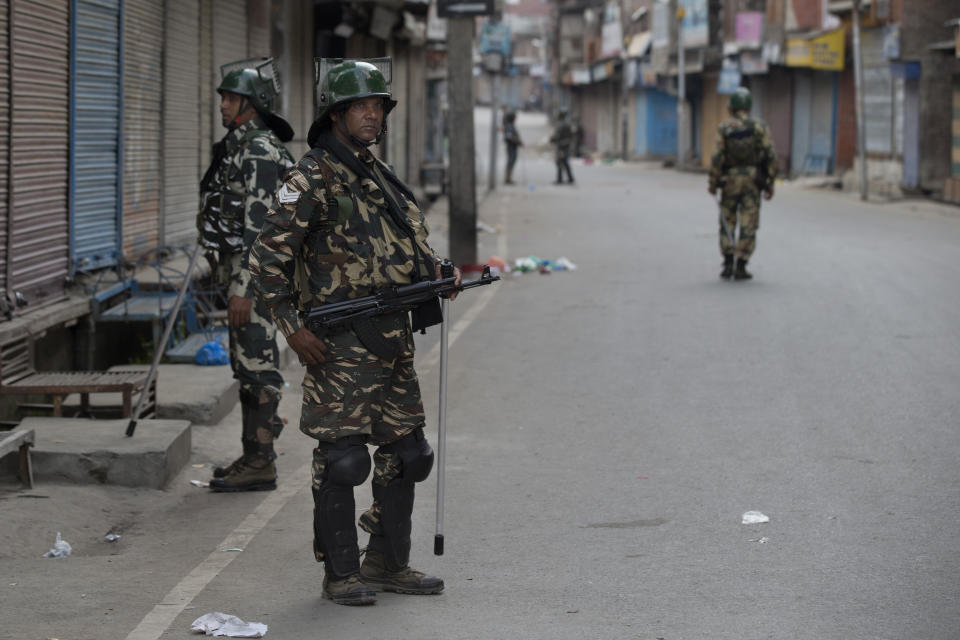 In this Tuesday, Aug. 6, 2019 photo, Indian paramilitary soldiers patrol during curfew in Srinagar, Indian controlled Kashmir. The lives of millions in India's only Muslim-majority region have been upended since the latest — and most serious — crackdown followed a decision by New Delhi to revoke the special status of Jammu and Kashmir and downgrade the Himalayan region from statehood to a territory. Kashmir is claimed in full by both India and Pakistan, and rebels have been fighting Indian rule in the portion it administers for decades. (AP Photo/Dar Yasin)