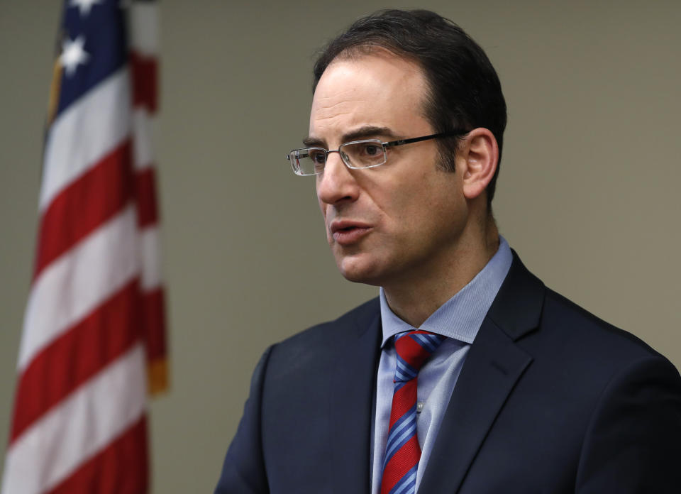 Colorado Attorney General Phil Weiser speaks about the plan to have a former federal prosecutor review the sexual abuse files of Colorado's Roman Catholic dioceses at a news conference Tuesday, Feb. 19, 2019, in Denver. The church will pay reparations to victims under a voluntary joint effort with the state attorney general. (AP Photo/David Zalubowski)