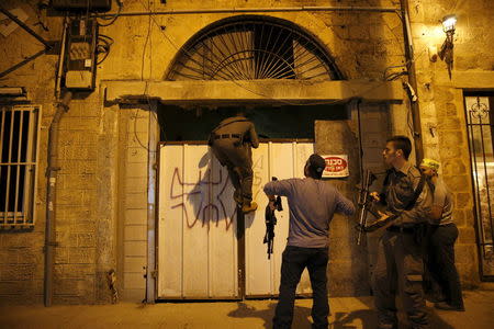 Israeli security forces search the area where, according to Israeli police spokesperson, at least 10 Israelis were stabbed, in the popular Jaffa port area of Tel Aviv, Israel March 8, 2016. REUTERS/Amir Cohen