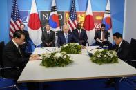 President Joe Biden meets with South Korea's President Yoon Suk Yeol, left, and Japan's Prime Minister Fumio Kishida during the NATO summit in Madrid, Wednesday, June 29, 2022. (AP Photo/Susan Walsh)