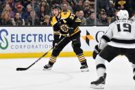 Feb 9, 2019; Boston, MA, USA; Boston Bruins center Patrice Bergeron (37) looks to pass in front of Los Angeles Kings left wing Alex Iafallo (19) during the third period at the TD Garden. Mandatory Credit: Brian Fluharty-USA TODAY Sports