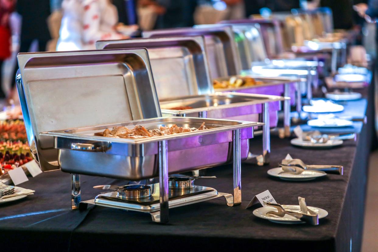 catering dishes with food on table for a large group