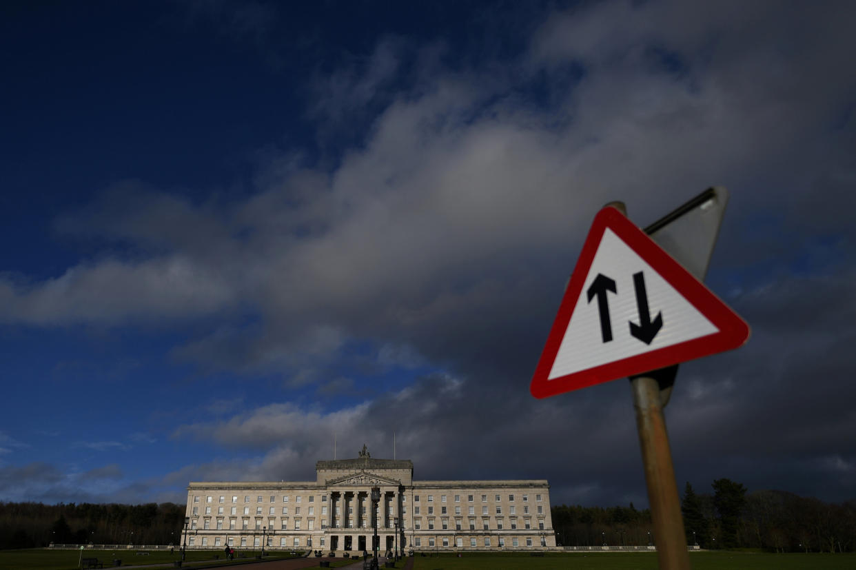 A road sign is seen in front of Parliament Buildings at Stormont in Belfast, Northern Ireland. Photo: Reuters