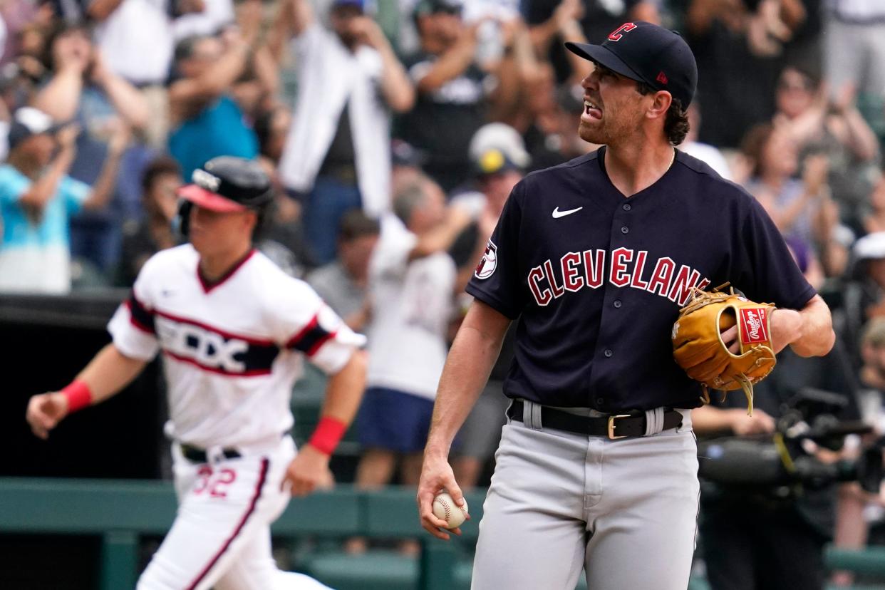 Cleveland Guardians starting pitcher Shane Bieber reacts as he looks up after Chicago White Sox's Leury Garcia hit a two-run home run during the second inning of a baseball game in Chicago, Sunday, July 24, 2022. (AP Photo/Nam Y. Huh)
