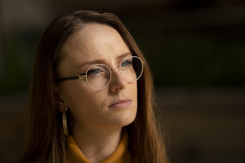 Charlotte Bennett, a former health policy aide to former Gov. Andrew Cuomo, pauses during an interview in New York on Tuesday, Oct. 12, 2021. As the #MeToo movement reaches its four-year mark, Bennett says, “I’d like to think that now, we are believed. ... That the difference is, we are not convincing our audience that something happened and trying to persuade them that it impacted us. I would really like to think we’re in a place now where it’s not about believability – and that we don’t have to apologize.” (AP Photo/John Minchillo)