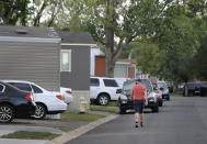 ADVANCE ON THURSDAY, SEPT. 12 FOR USE ANY TIME AFTER 3:01 A.M. SUNDAY SEPT 15 - In this Aug. 30th 2019 photo shows residents of Lamplighter Village, a manufactured and mobile home park, spending time outdoors in their community in Federal Heights, Colo. Across Colorado, where the housing crisis impacts both rural and urban towns, the strife between mobile home park residents and park owners approaches a boiling point. The business model -- in which homeowners pay lot rent to park their houses on someone else's land -- capitalizes on the immobility and economic fragility of tenants who often can't afford to move or live anywhere else.(Kathryn Scott/The Colorado Sun)