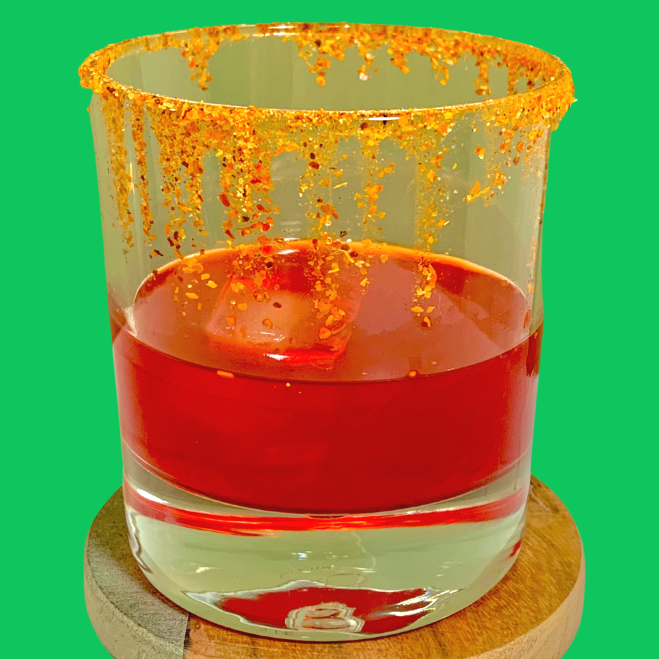 short glass rimmed with tajin