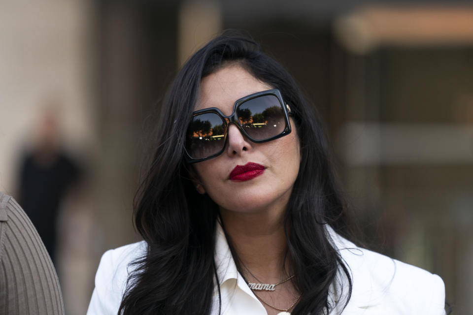 Vanessa Bryant, center, Kobe Bryant&#39;s widow, leaves a federal courthouse in Los Angeles, Wednesday, Aug. 24, 2022. A federal jury has found that Los Angeles County must pay Kobe Bryant&#39;s widow $16 million over photos of the NBA star&#39;s body at the site of the 2020 helicopter crash that killed him. The jurors who returned the verdict Wednesday, Aug. 24, 2022, agreed with Vanessa Bryant and her attorneys that her privacy was invaded when deputies and firefighters took and shared photos of the remains of Kobe Bryant and their 13-year-old daughter Gianna. (AP Photo/Jae C. Hong)