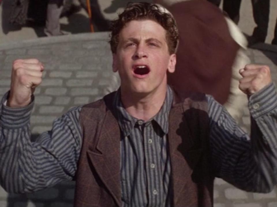 david moscow as davey in newsies singing with his fists to the sun