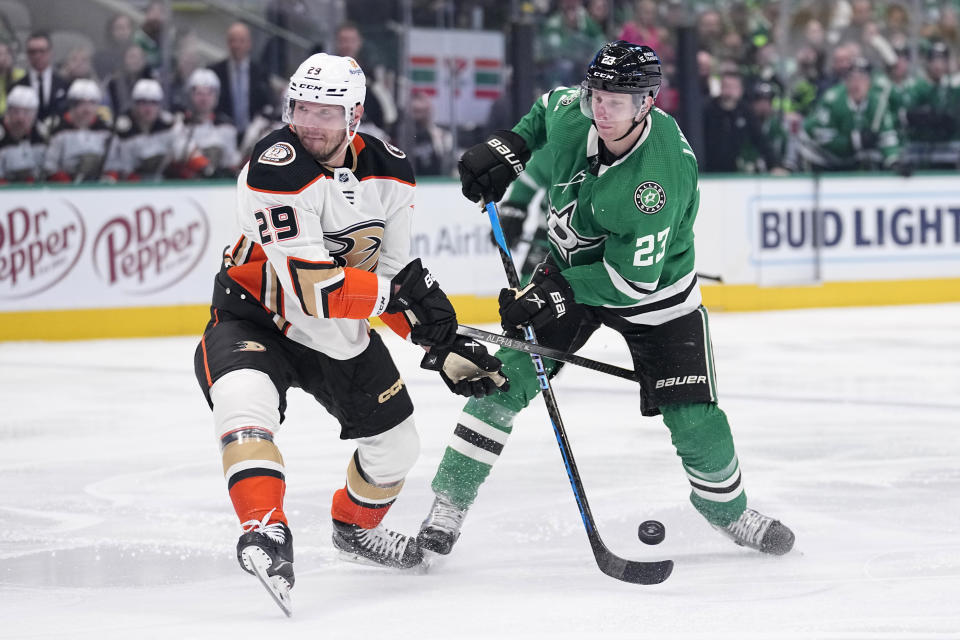 Anaheim Ducks defenseman Dmitry Kulikov (29) blocks a pass by Dallas Stars defenseman Esa Lindell (23) in the first period of an NHL hockey game, Monday, Feb. 6, 2023, in Dallas. (AP Photo/Tony Gutierrez)