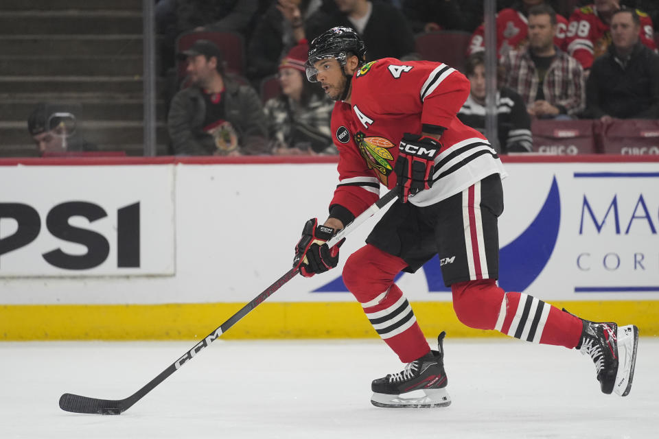 Chicago Blackhawks defenseman Seth Jones handles the puck during the first period of an NHL hockey game against the Minnesota Wild, Wednesday, Feb. 7, 2024, in Chicago. (AP Photo/Erin Hooley)