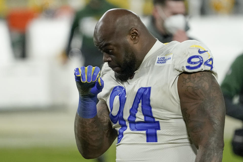 Los Angeles Rams defensive tackle A'Shawn Robinson walks off the field after an NFL divisional playoff football game against the Green Bay Packers Saturday, Jan. 16, 2021, in Green Bay, Wis. The Packers defeated the Rams 32-18 to advance to the NFC championship game. (AP Photo/Morry Gash)