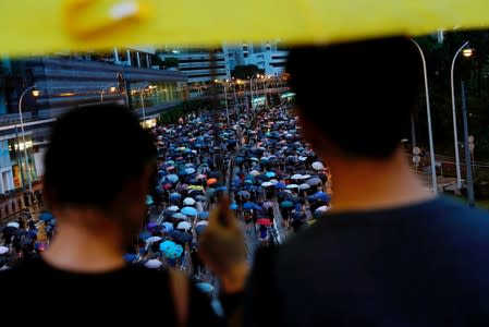 People march during a rally to demand democracy and political reforms in Hong Kong