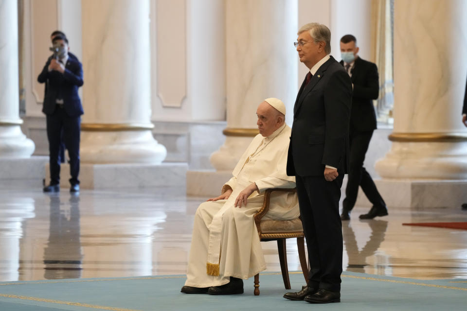 Pope Francis attends with Kazakhstan's President Kassym-Jomart Tokayev the welcome ceremony at the Presidential Palace Ak Orda, in Nur-Sultan, Kazakhstan, Tuesday, Sept. 13, 2022. Pope Francis begins a 3-days visit to the majority-Muslim former Soviet republic to minister to its tiny Catholic community and participate in a Kazakh-sponsored conference of world religious leaders. (AP Photo/Andrew Medichini)