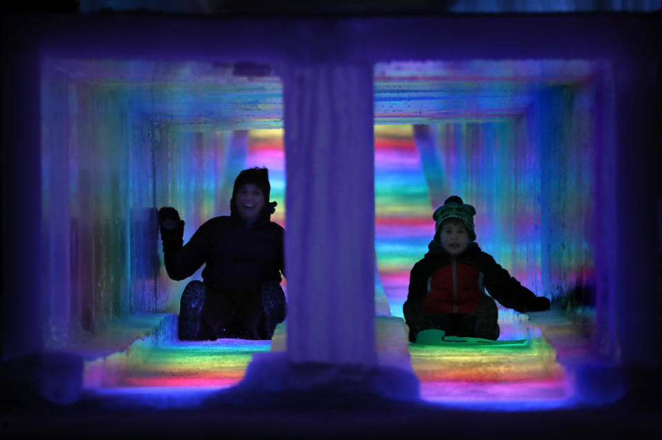 Visitors race down the side-by-side tunnels of a 97-foot ice slide at Ice Castles in North Woodstock, N.H. The winter wonderland is one of six in North America. (Photo: Robert F. Bukaty/AP)