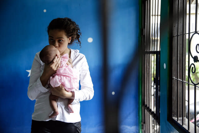 Heather Mack holds her baby daughter